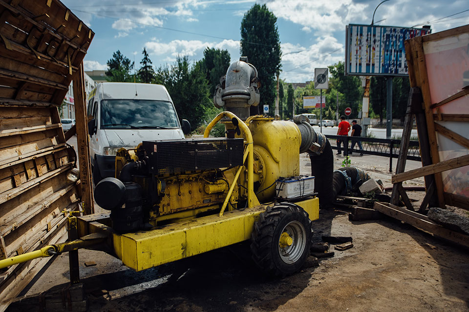 A plumbing company performing hydro jet plumbing on a sewer pipe