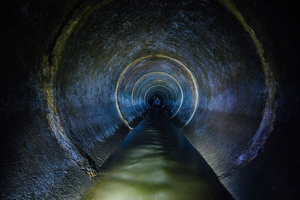 Sewage water sitting in a sewage pipe after being sent from a sewage pump