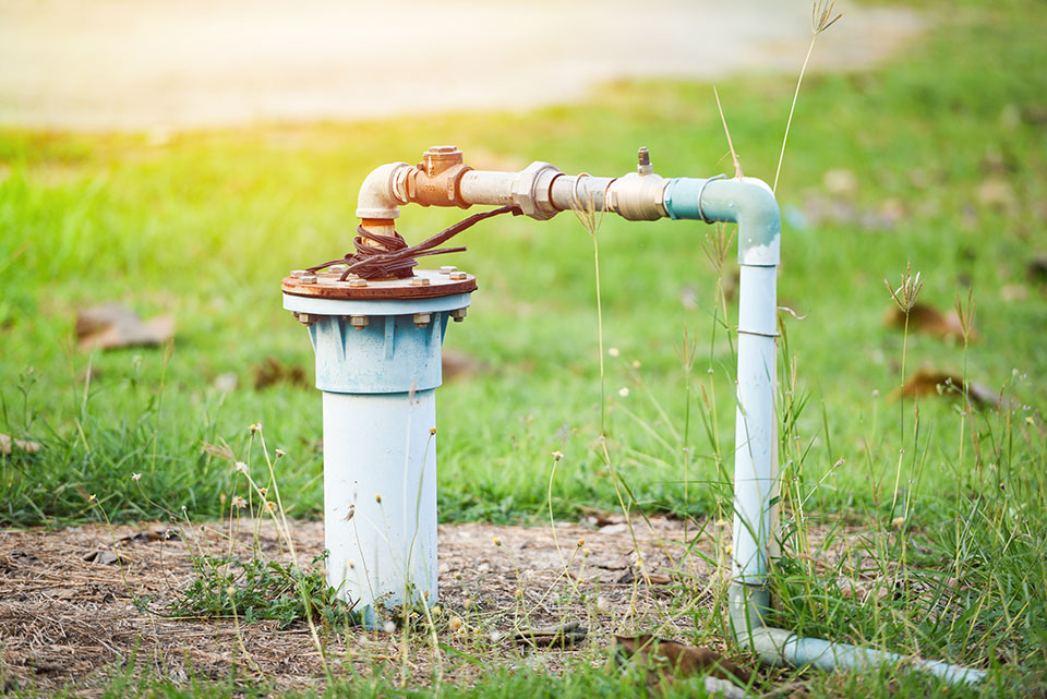 A working water well in the ground after it has received well service